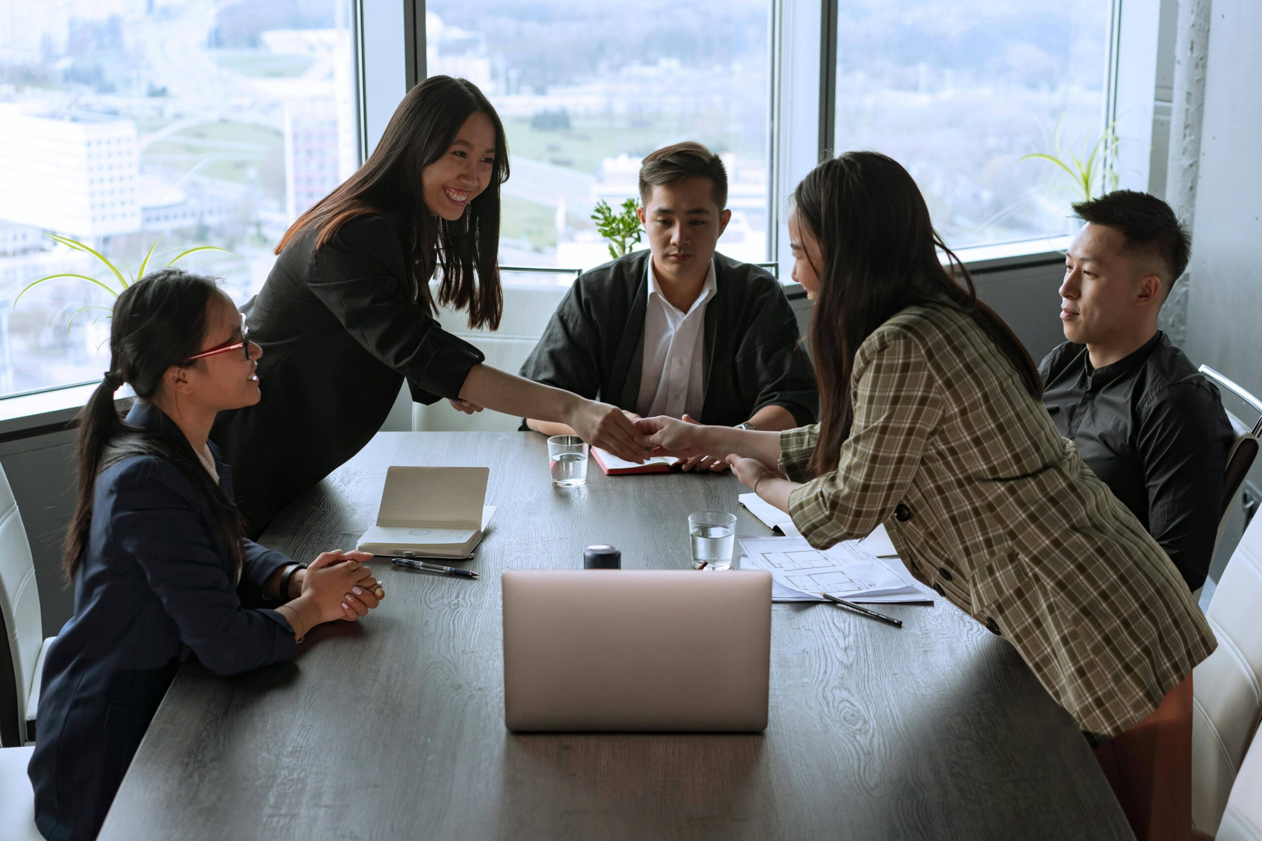 Professional team having a discussion in a cabin meeting room.